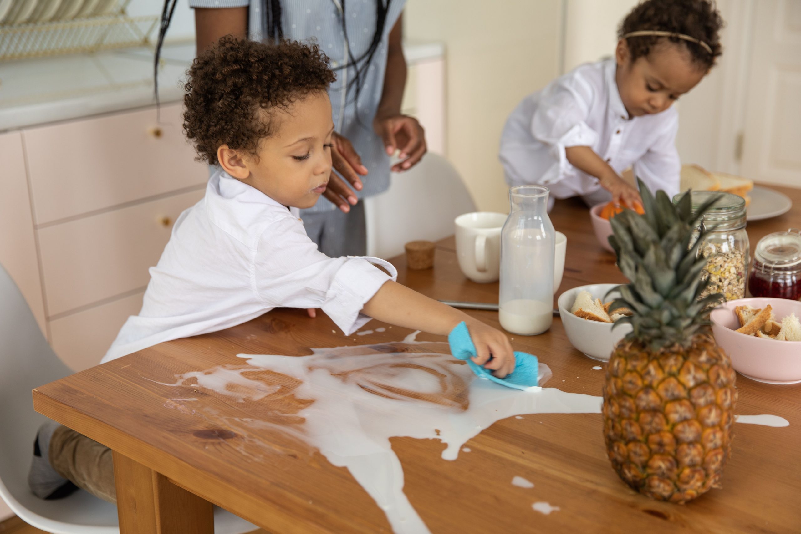 A kitchen counter being wiped, showing how to keep a clean house with kids
