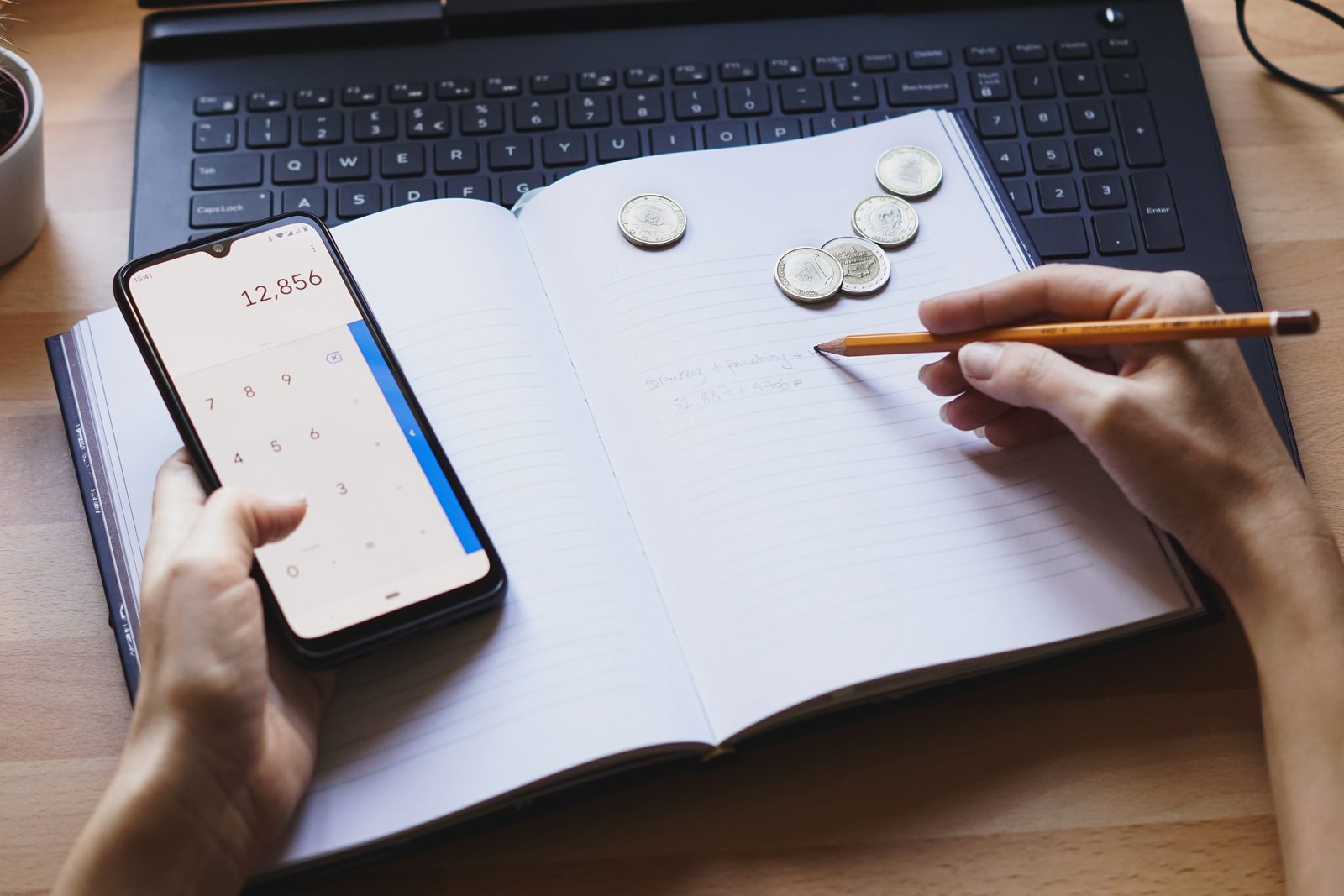 A notebook used to track your expenses, with categories and weekly totals